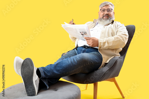 Mature man with pen and new...