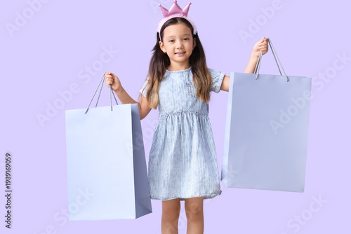Cute little girl with shopp...