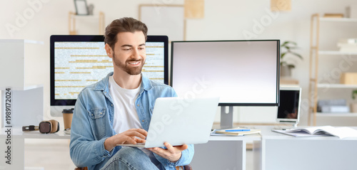 Male programmer with laptop...