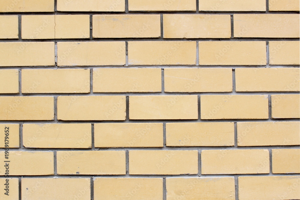 Obraz premium Texture of yellow brick wall.