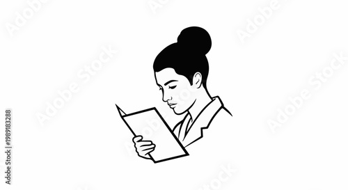 Person with hair in a bun reads an open book