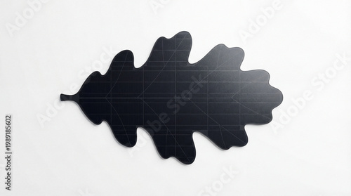 Solar panel in the shape of an oak leaf isolated on white background