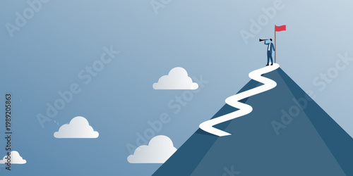 A businessperson reaches a summit after navigating a winding path