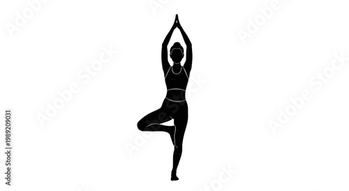 Woman in yoga tree pose standing.