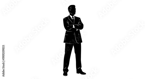 Businessman standing with arms crossed.