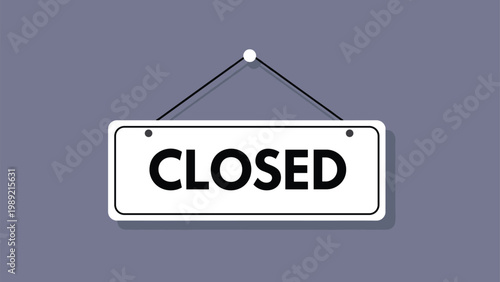 Closed sign for business hanging on a wall with shadow effect represents end of operation hours or temporary closure.