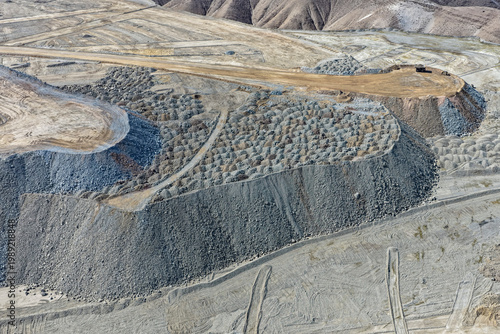 Panoramic view of a huge mine waste dump and its tiered structure