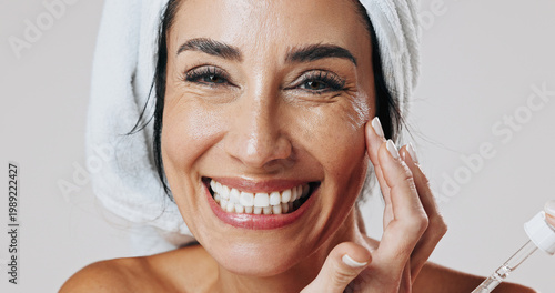 Fotografi Skincare, portrait and woman with dropper in studio, hyaluronic acid treatment or anti aging product