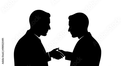 Two businessmen shaking hands in agreement.