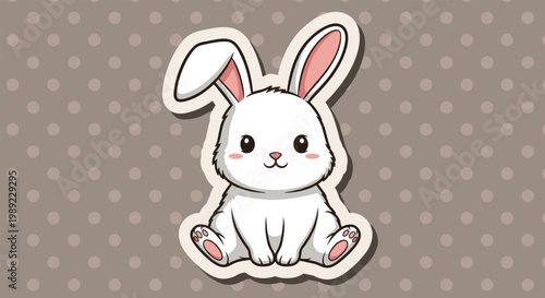 Adorable white cartoon rabbit sticker with pink ears sits peacefully on a light brown background with white polka dots.