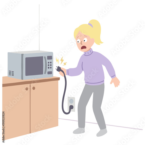 Woman gets shocked by a microwave in a kitchen