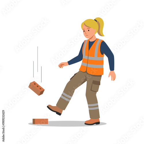 Woman kicks brick on construction site wearing safety vest