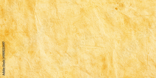 Vintage crumpled paper texture background with yellow beige color and rough organic look for design