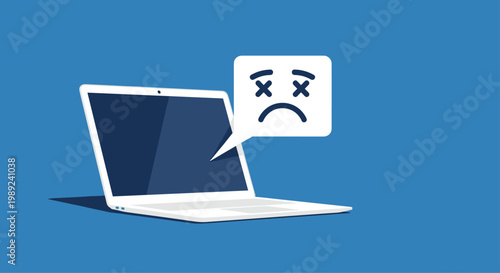 Laptop screen displaying a sad face emoticon with crossed-out eyes indicates a technical error or system crash on a dark blue background.