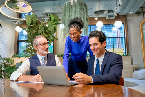 Group of business team working in co-working space office with document paper.