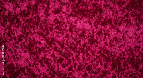 A close-up view of a richly textured, deep magenta velvet fabric background.