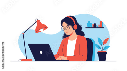 Focused young woman with headphones working on her laptop at a desk with a warm lamp and indoor green plant.