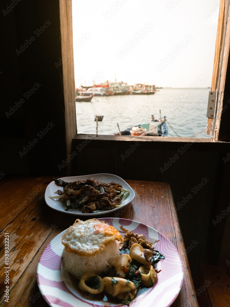 Fototapeta premium Seafood breakfast scene, Relaxed seaside meal with natural sunlight