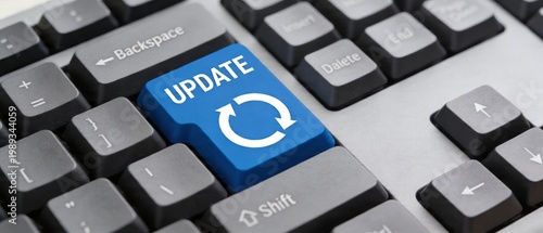 The image shows a close-up of a computer keyboard with a blue update button.