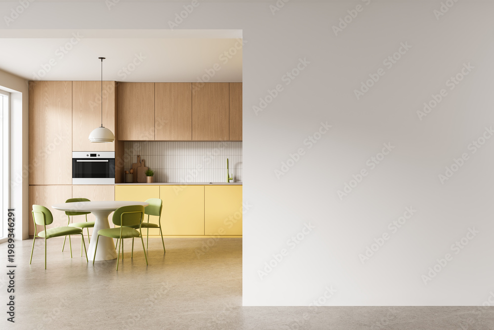 Fototapeta premium Modern kitchen interior with wooden cabinets, yellow cabinetry, dining table set and spacious empty wall space for design display. 3D Rendering