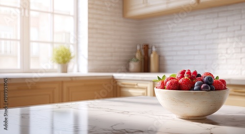 A vibrant bowl of fresh strawberries and blueberries sits on a marble countertop in a bright, modern kitchen with wooden cabinets and a window overlooking a lush garden.