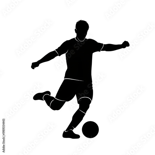 Silhouette of Soccer Player Kicking Ball.
