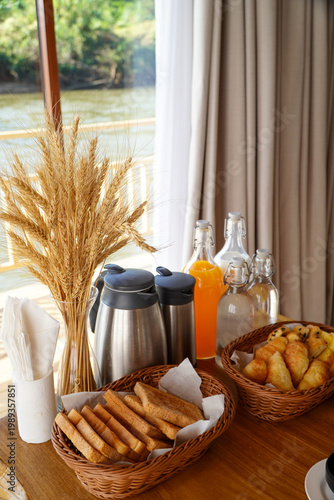 Healthy breakfast with freshly baked croissants against. delicious breakfast with fresh orange juice and milk by the window.