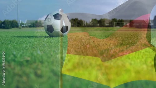 Breeze starting, soccer ball resting beside corner flag, sheer flag waving, showing corner setup