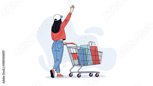 Fashionable young woman in jeans and a red sweater waves while pushing a shopping cart filled with colorful paper bags.