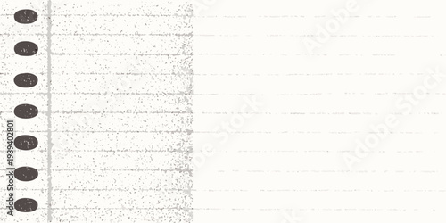 Close up of a torn lined paper sheet with punched holes