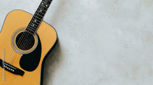 Classic acoustic guitar on a grey cement surface, flat lay composition. tutorial guides, club newsletters, designed for tourism and weekend activity guides, inspires participation.