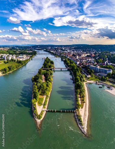 Aerial View Of A Long Green River Island Splitting The Danube In Regensburg Germany Under A Bright Blue With White Clouds During Daytime