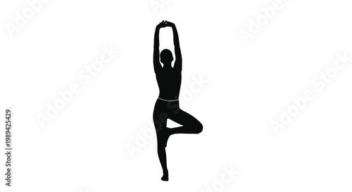 Silhouette of a woman performing a tree pose yoga position