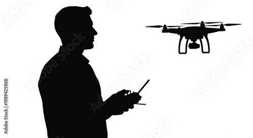 Silhouette of a man operating a drone with a remote controller