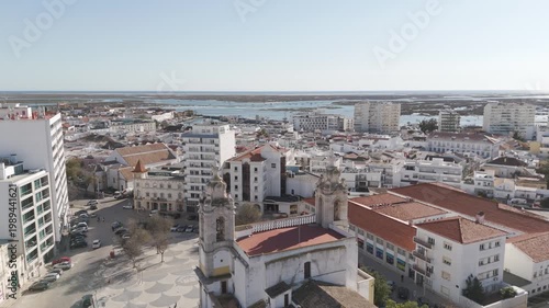 Aerial drone flight over the Igreja do Carmo church in Faro, Portugal.