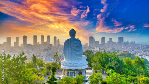 Canvastavla A majestic view of the giant white Buddha statue at Long Son Pagoda, Nha Trang, Vietnam peacefully seated atop a hill overlooking the city