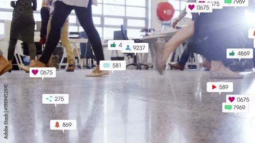 Business team walking across floor, sparking social icons around feet and tracking engagement rise