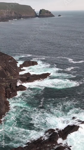 Experience the untamed beauty of the ocean meeting the dramatic cliffs.