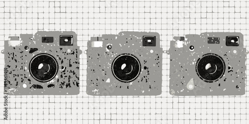 Three vintage cameras arranged in a row on a tiled background