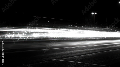 Bright light trails illustrate the energetic flow of vehicles moving swiftly at night