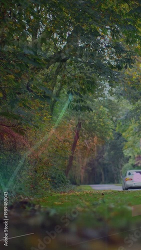 Vertical video: White sedan moving away down road, animated bars sliding aside revealing tech chart