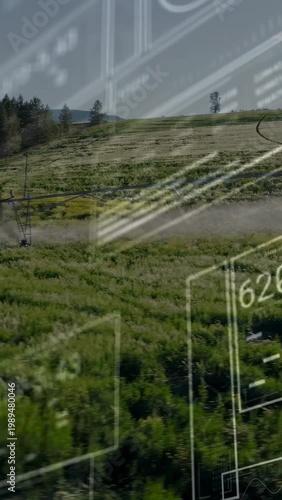 Vertical video: Camera panning showing pivot spraying mist, HUD obscuring field for farm monitoring