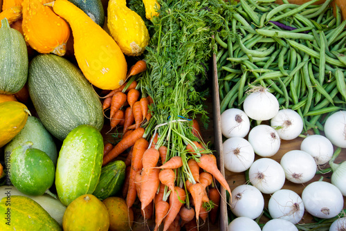 Mixed fresh vegetables arranged at produce market