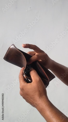 hand holding an empty wallet