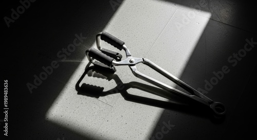 Metal Beaker Tongs with Grips on Textured Surface