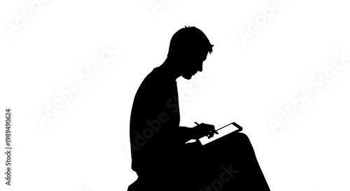 Man reading a book sitting down.