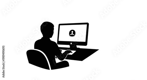 Man sitting at computer desk.