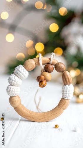 A wooden baby toy is centrally positioned against a blurred background with soft lights and seasonal greenery