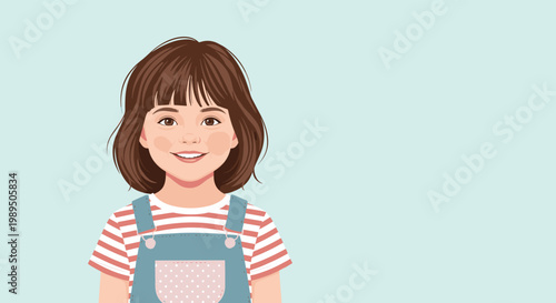 Cute portrait of a young girl with brown hair and bangs wearing a striped t-shirt and light blue denim overalls with a pocket.