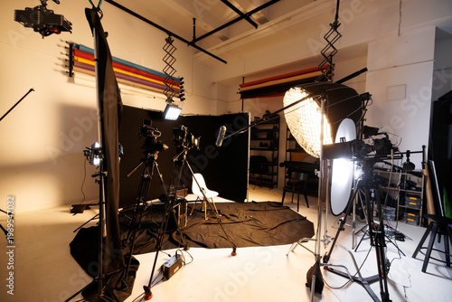 Bright studio designed for filming interviews, featuring modern lighting and various cameras positioned for optimal shots. A perfect space for captivating conversations and streaming